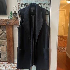 Black sleeveless duster